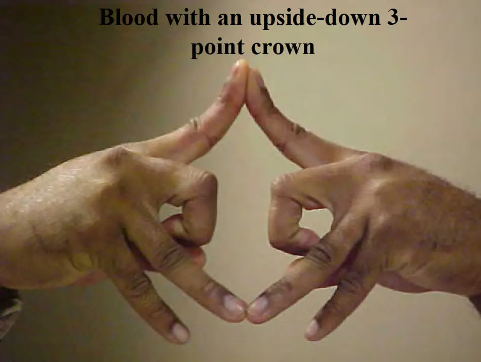 Upside down 3 point crown gang sign