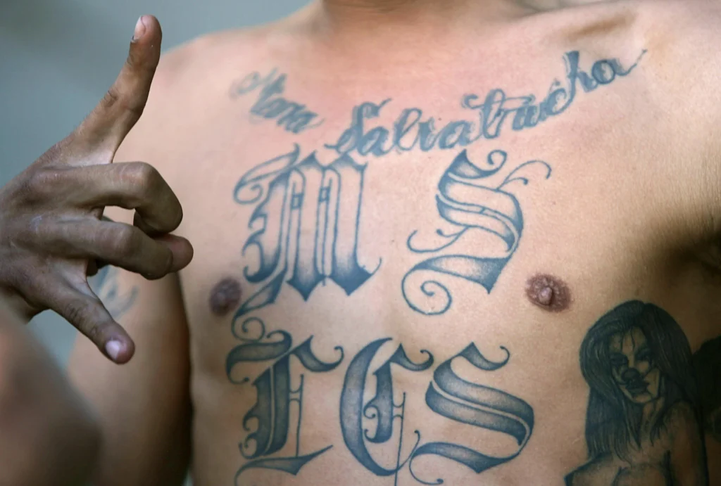 Mara Salvatrucha gang member showing M hand sign