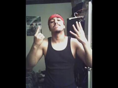 a gang member showing 14 sign using both hands