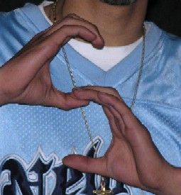 gang member showing S sign using both hands